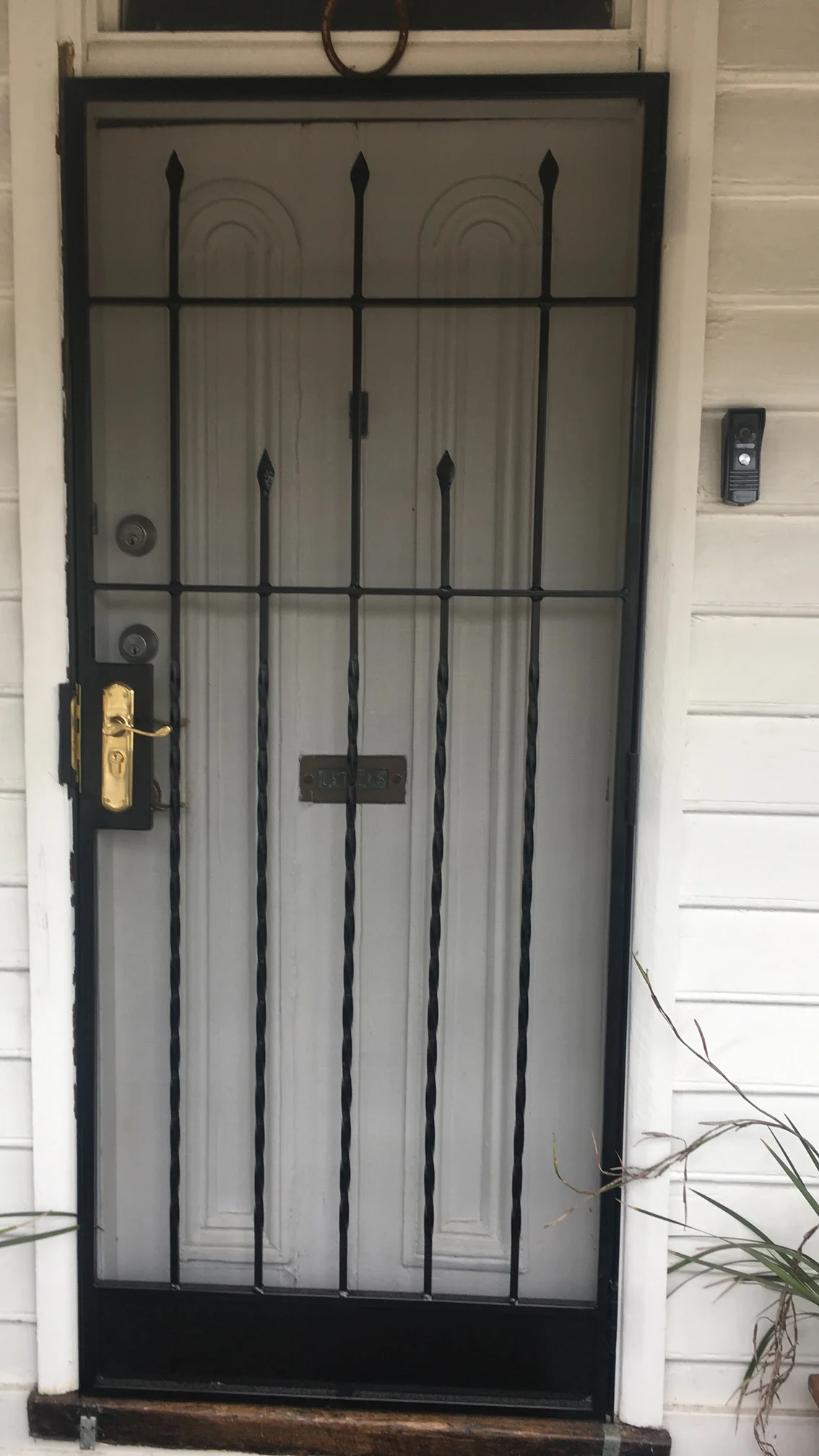 Black vertical-bar steel security screen door