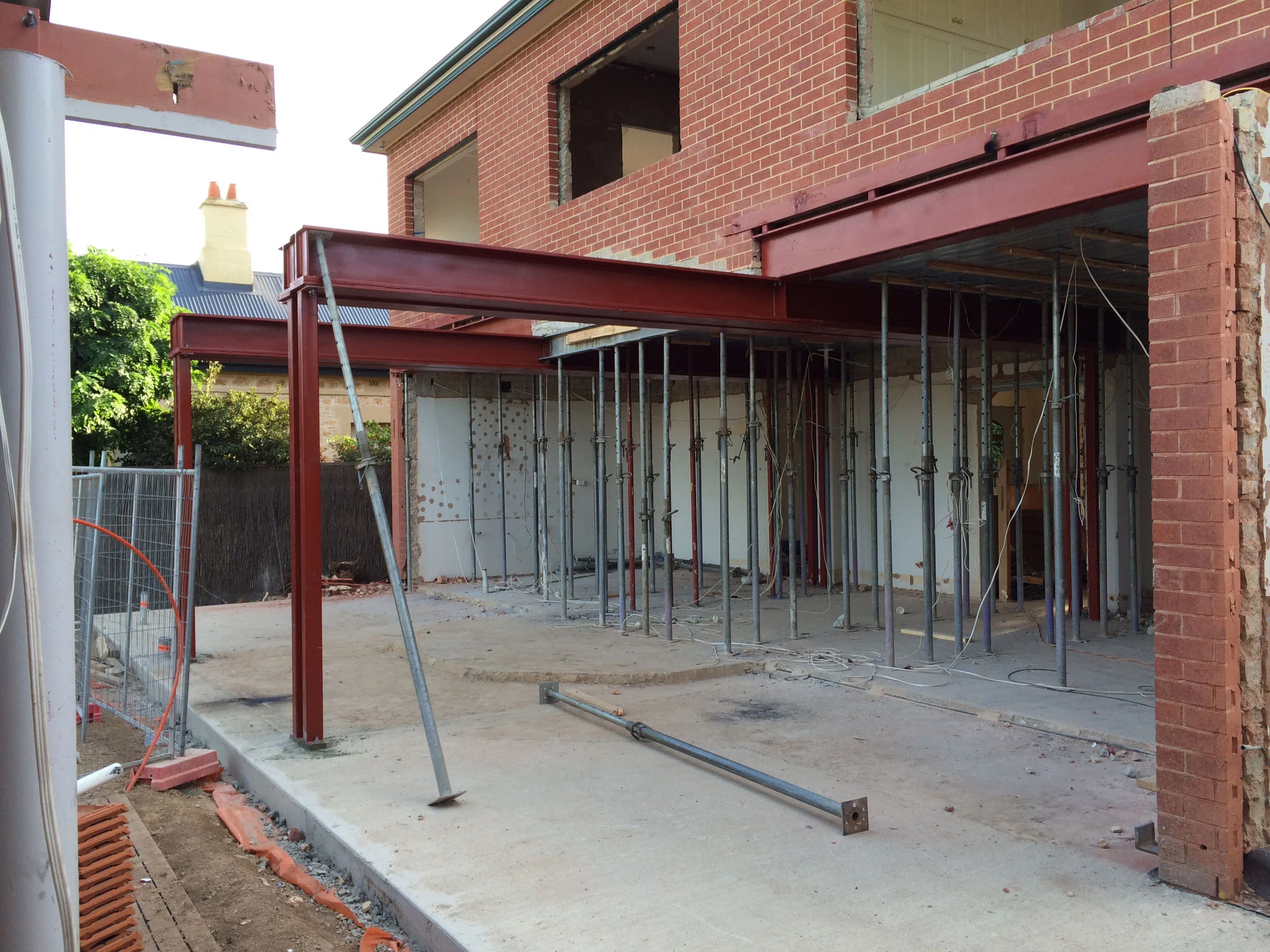 Steel beam and columns supporting a brick extension