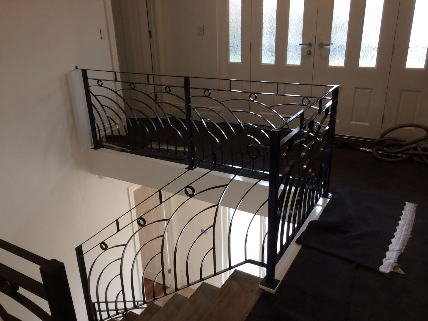 Wrought iron balustrade around an upper landing